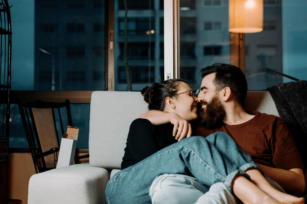 couple on couch celebrating an at-home date night