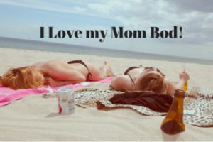 2 women on beach: i love my mom bod!