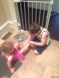 aaron helping olivia with shoes
