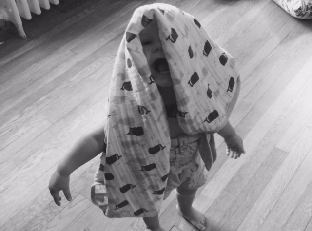 15-month-old child with blanket on head