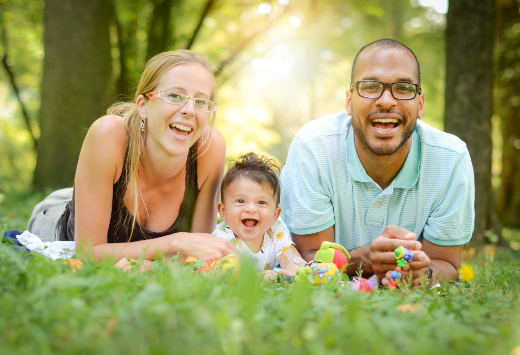 Happy interracial family in enjoying a day in the park