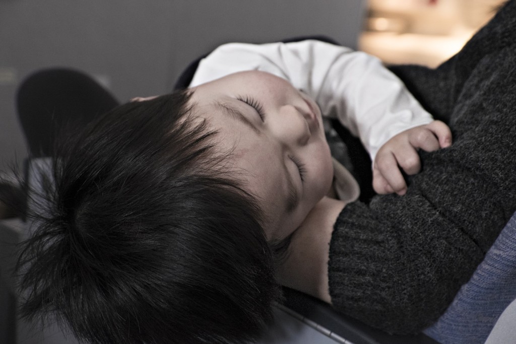 doctor - Boston Moms Blog - sick toddler in moms arms
