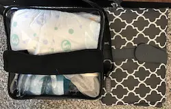 My clear diaper bag and clip-on diaper pad. 