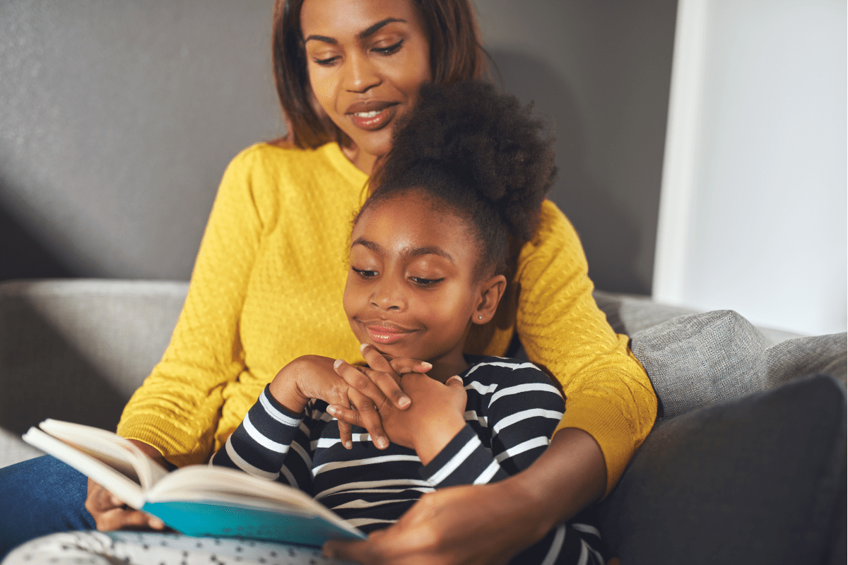 mom and daughter reading together, illustrating how Books can Teach Kids to Make the World a Better Place