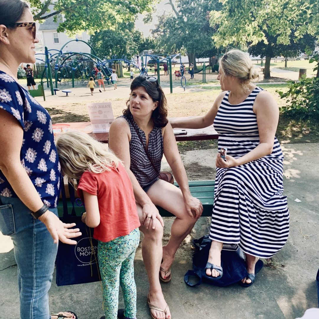 Moms talking at a local playground