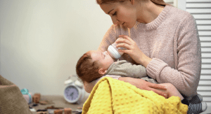 Mom feeding baby a bottle