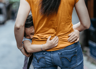 anxious child hugging anxious mother