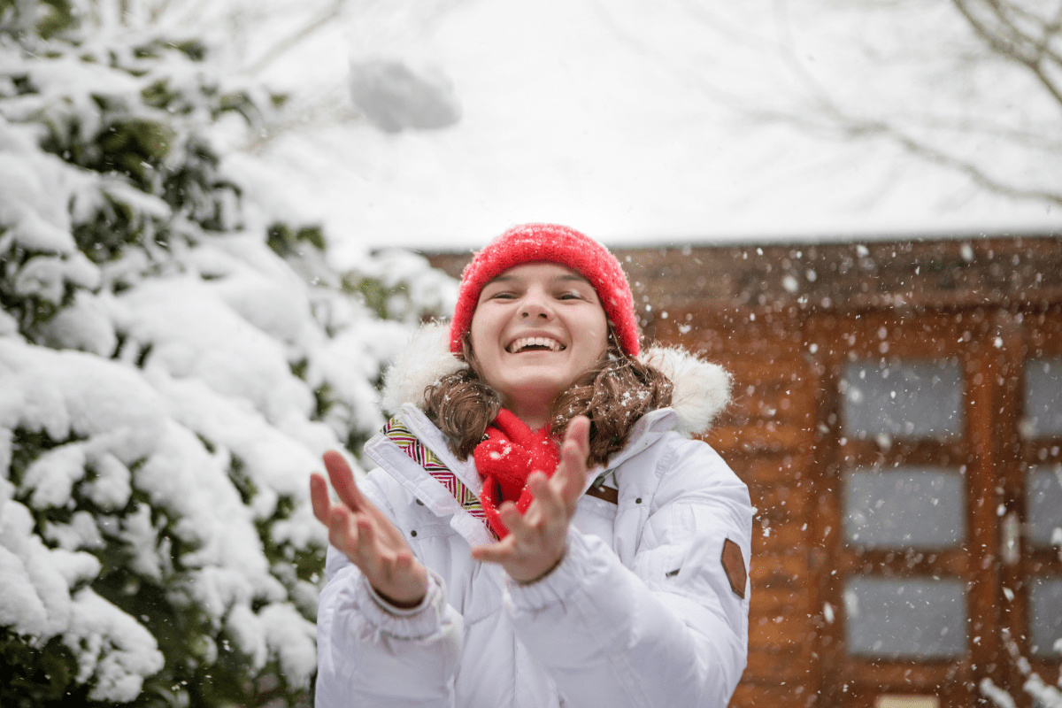 teenage girl in snow (keeping Christmas magic alive for older kids)