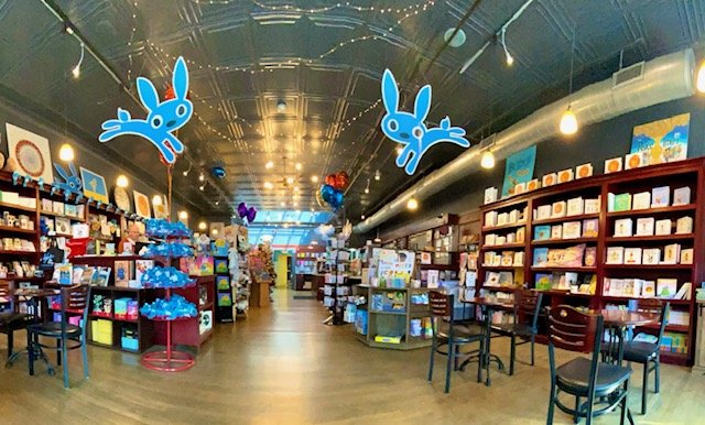 Inside of Blue Bunny bookstore. Shelves lined with books. 