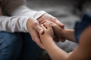 parent and child holding hands, lessons in grief from children