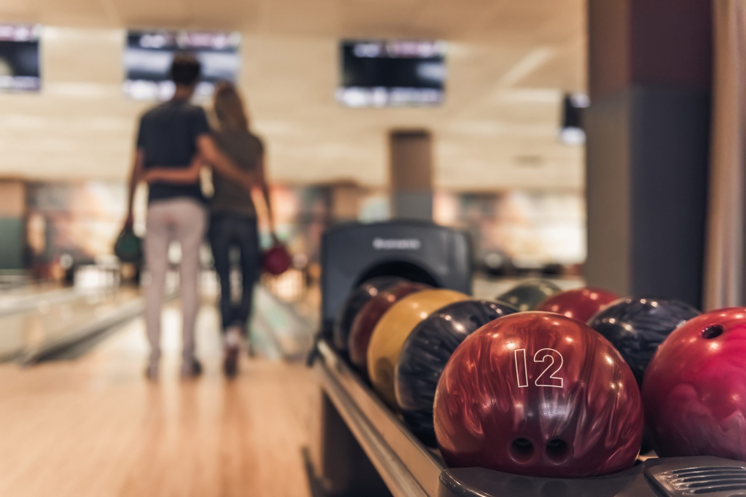 couple at bowling alley, day date ideas in Boston